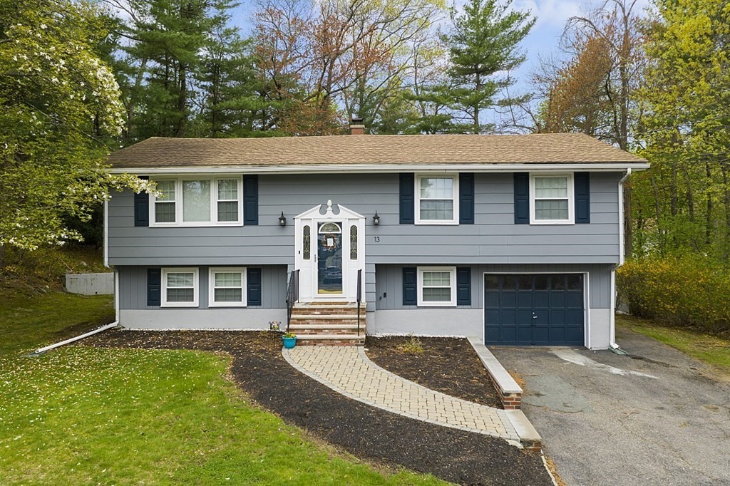 13 Clinton Road Peabody, MA 01960 - Photo 1 of 39 a front view of a house with garden
