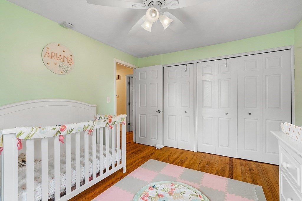 13 Clinton Road Peabody, MA 01960 - Photo 17 of 39 a bedroom with baby bed and a window