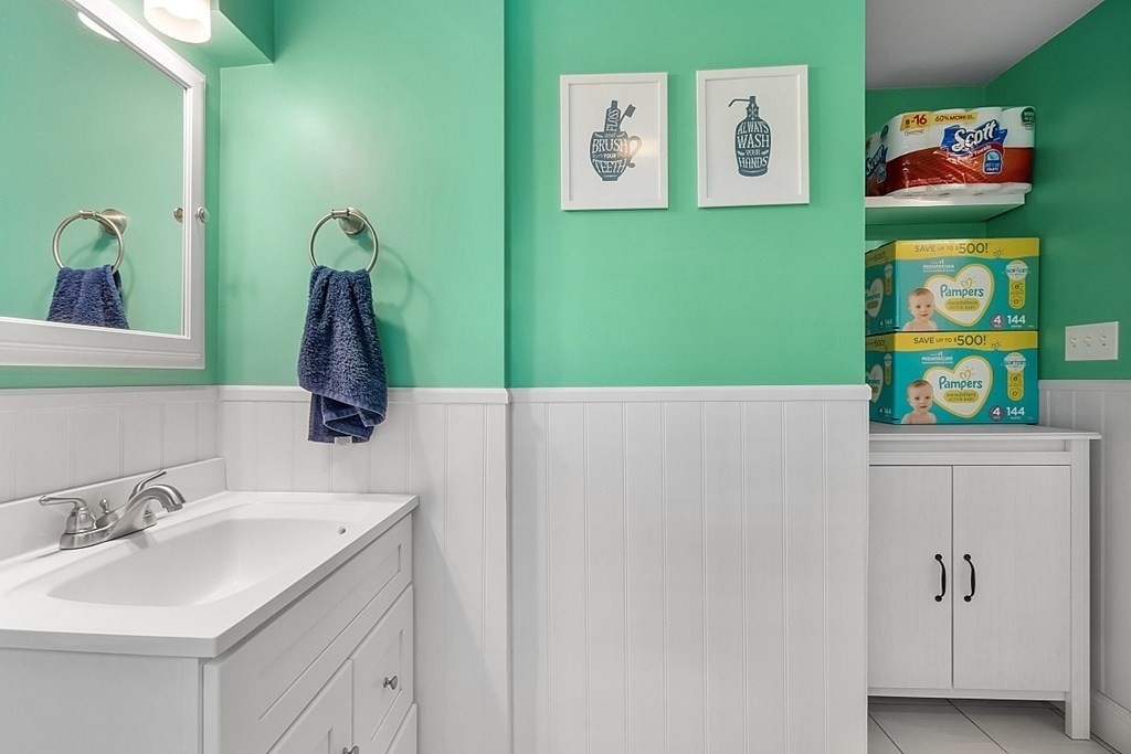 13 Clinton Road Peabody, MA 01960 - Photo 25 of 39 a bathroom with a sink and a mirror
