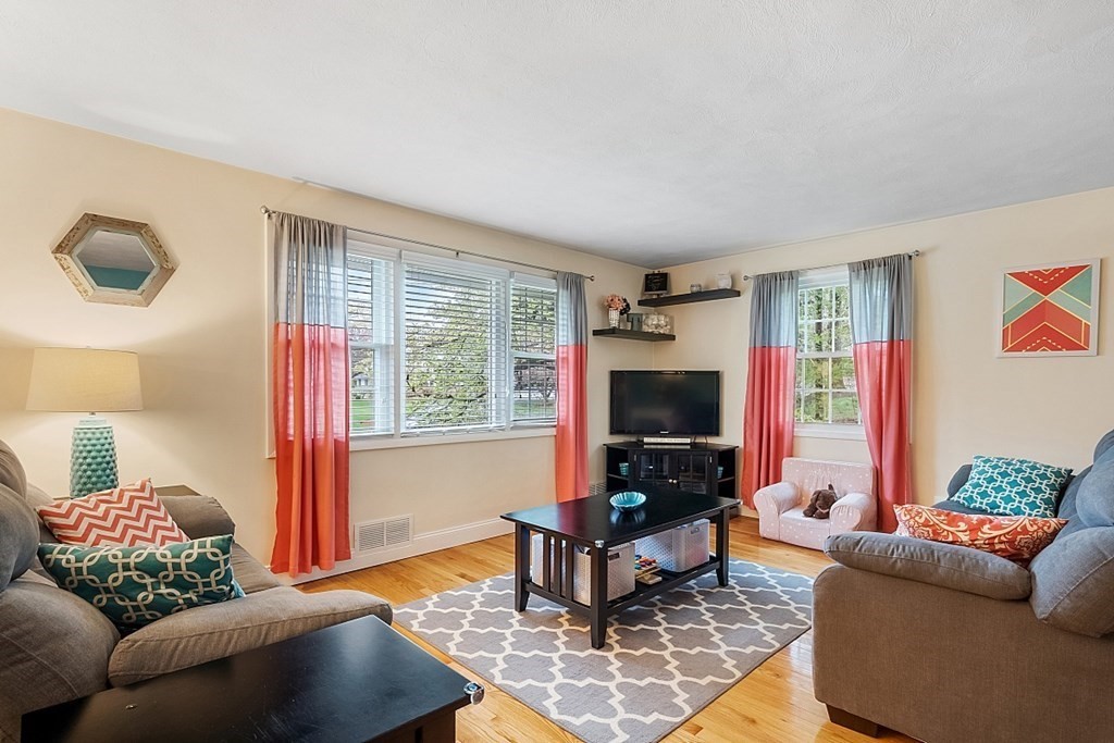 13 Clinton Road Peabody, MA 01960 - Photo 3 of 39 a living room with furniture and a flat screen tv