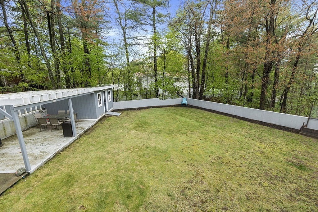 13 Clinton Road Peabody, MA 01960 - Photo 33 of 39 a view of a backyard with a large tree