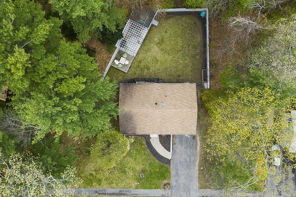13 Clinton Road Peabody, MA 01960 - Photo 34 of 39 an aerial view of a house with swimming pool and wooden fence