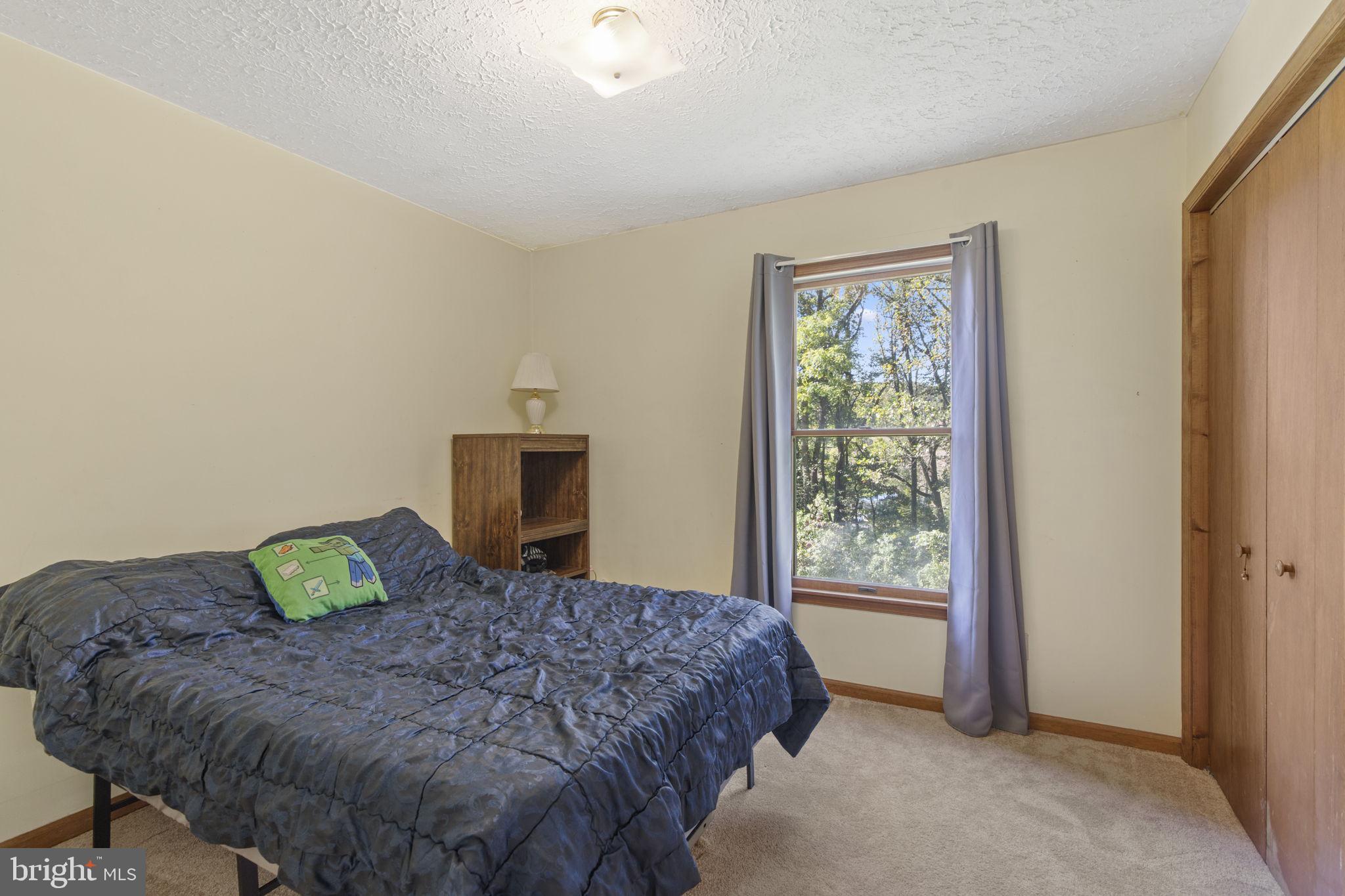 62 Porters Bridge Road Colora, MD 21917 - Photo 13 of 29 a bedroom with a bed and a window