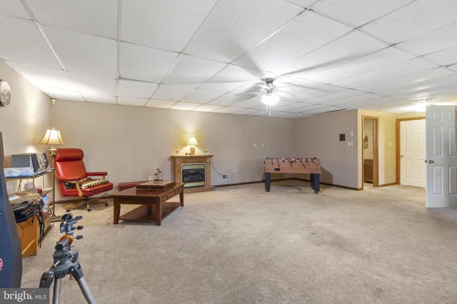 a living room with furniture and a lamp