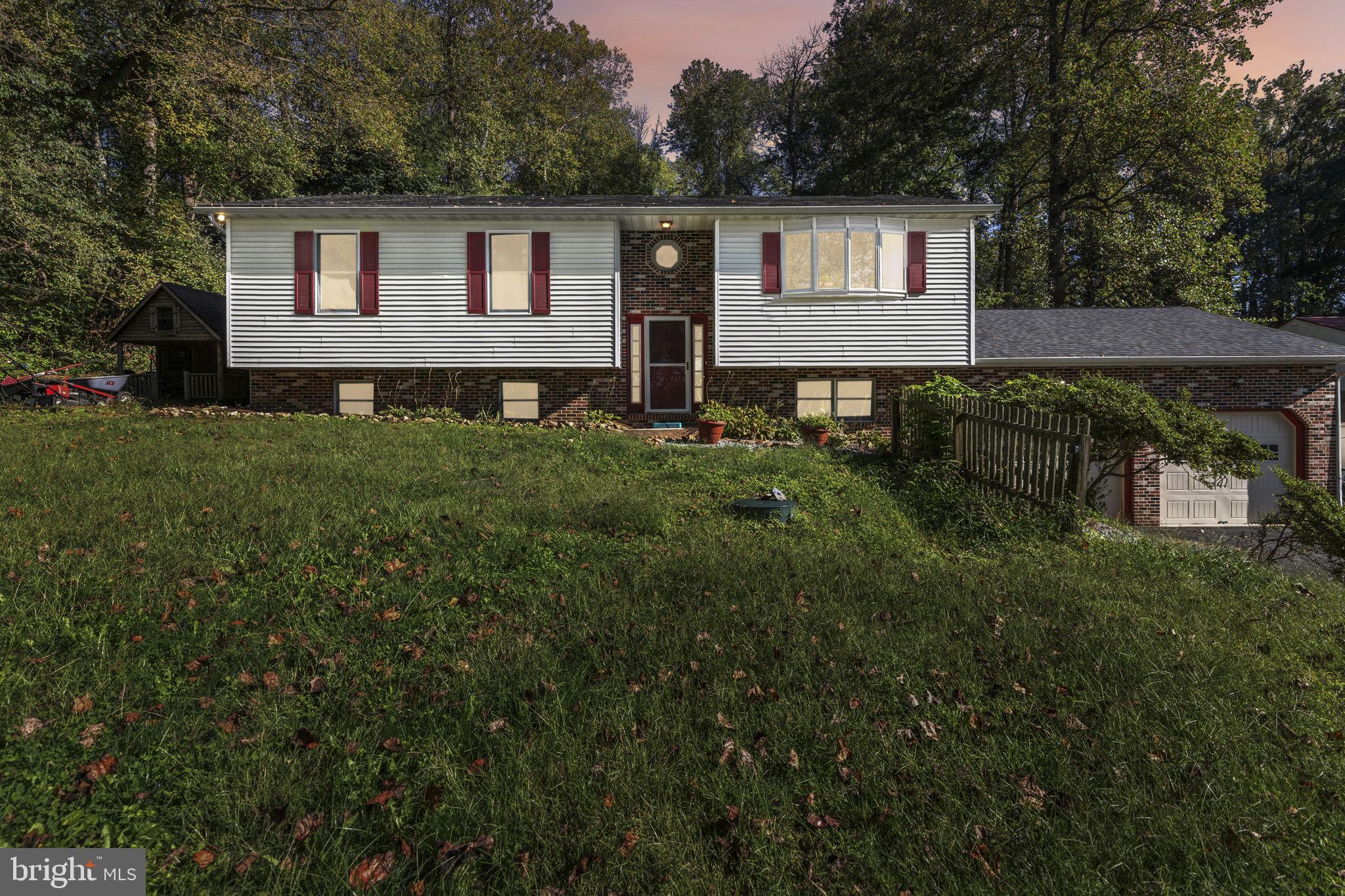 62 Porters Bridge Road Colora, MD 21917 - Photo 26 of 29 a front view of house with yard and trees in the background