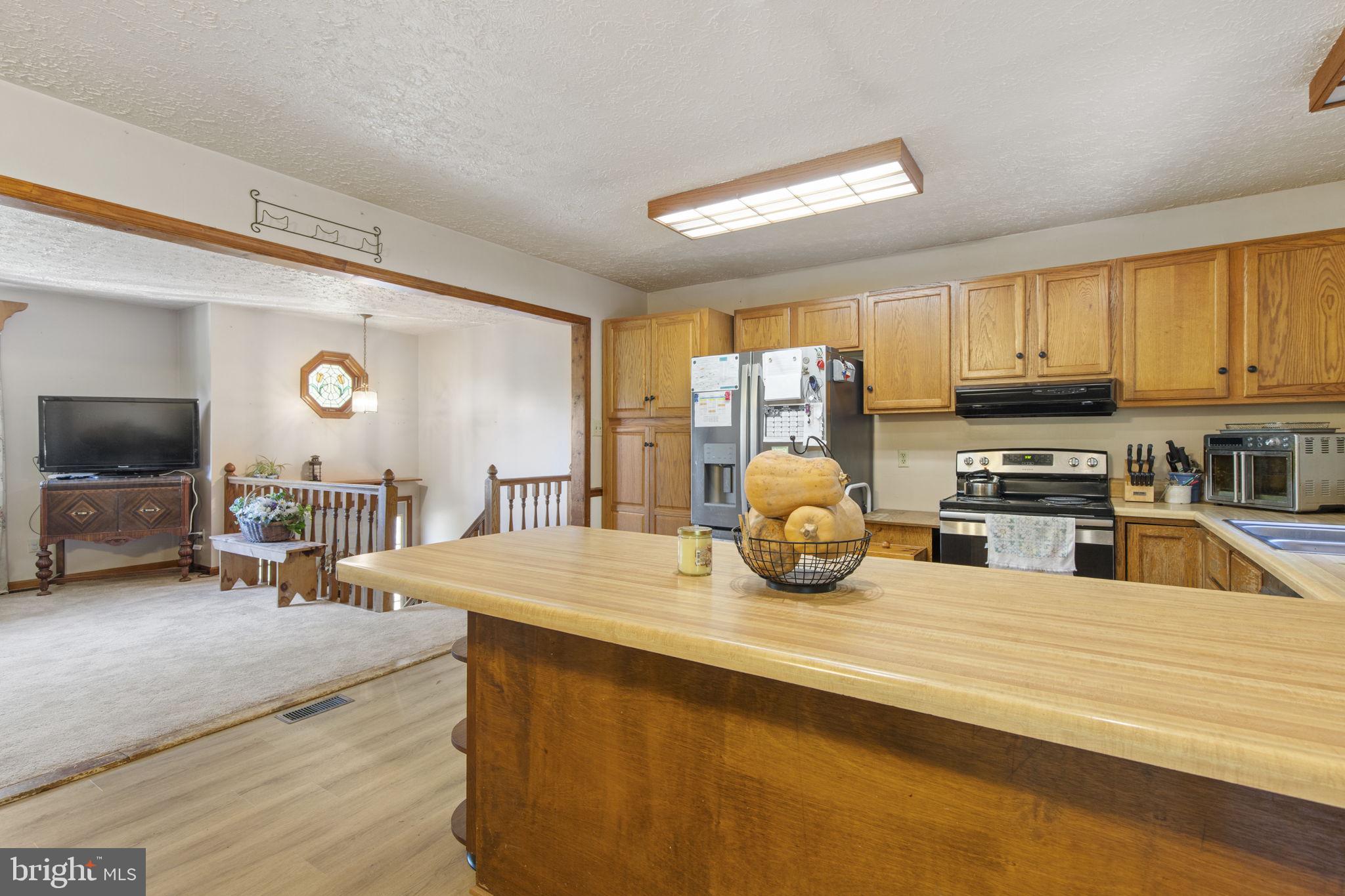 62 Porters Bridge Road Colora, MD 21917 - Photo 7 of 29 a kitchen with counter top space cabinets and stainless steel appliances