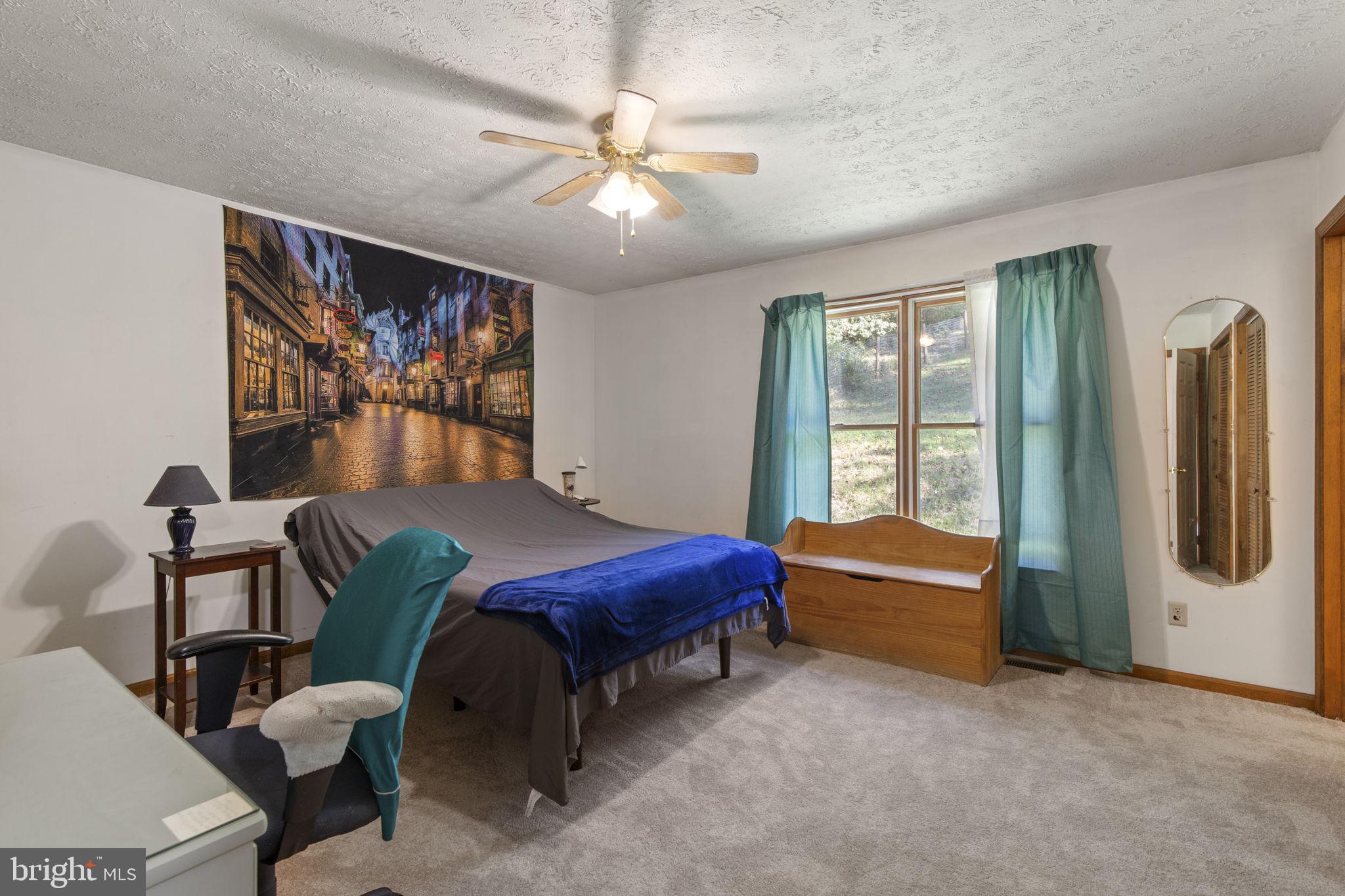 62 Porters Bridge Road Colora, MD 21917 - Photo 9 of 29 a living room with furniture and a flat screen tv