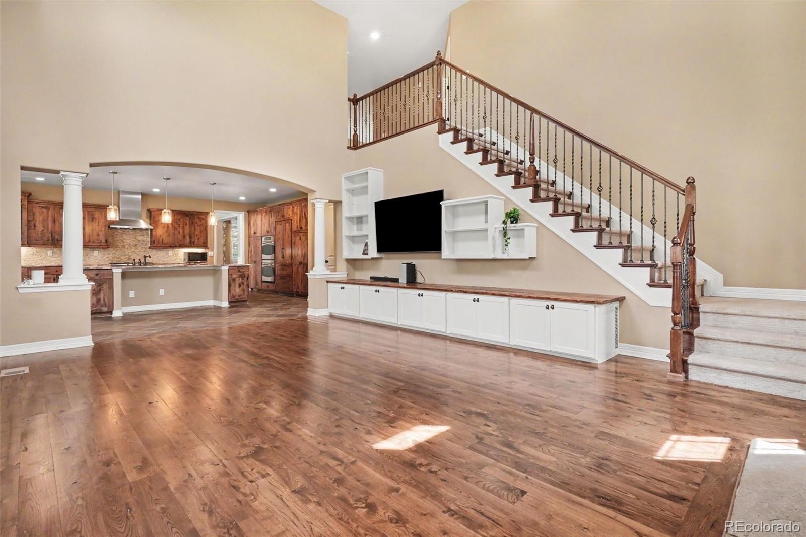 791 Elk Rest Road Evergreen, CO 80439 - Photo 18 of 46 a view of entryway and hall with wooden floor