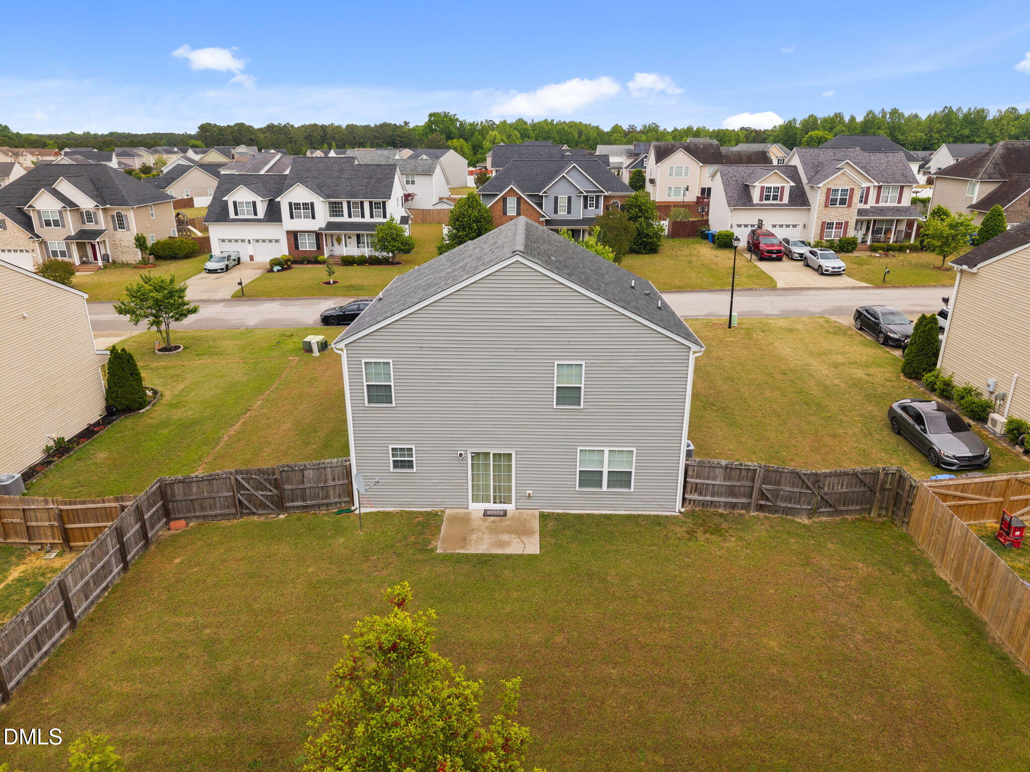 45 Crane Way Bunnlevel, NC 28323 - Photo 33 of 35 a aerial view of a house with a swimming pool and mountains