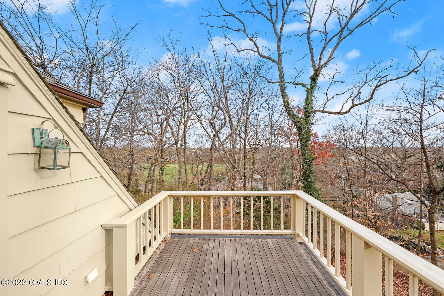141 Hendrie Avenue Riverside, CT 06878 - Photo 15 of 24 a view of balcony with wooden fence and trees