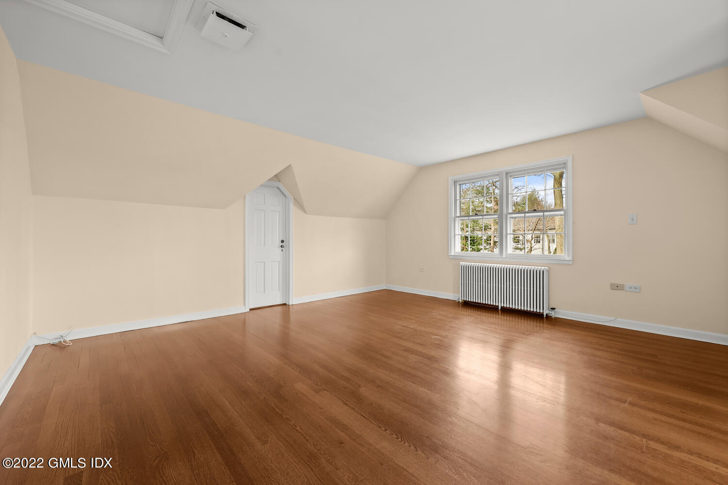 141 Hendrie Avenue Riverside, CT 06878 - Photo 16 of 24 an empty room with wooden floor and windows