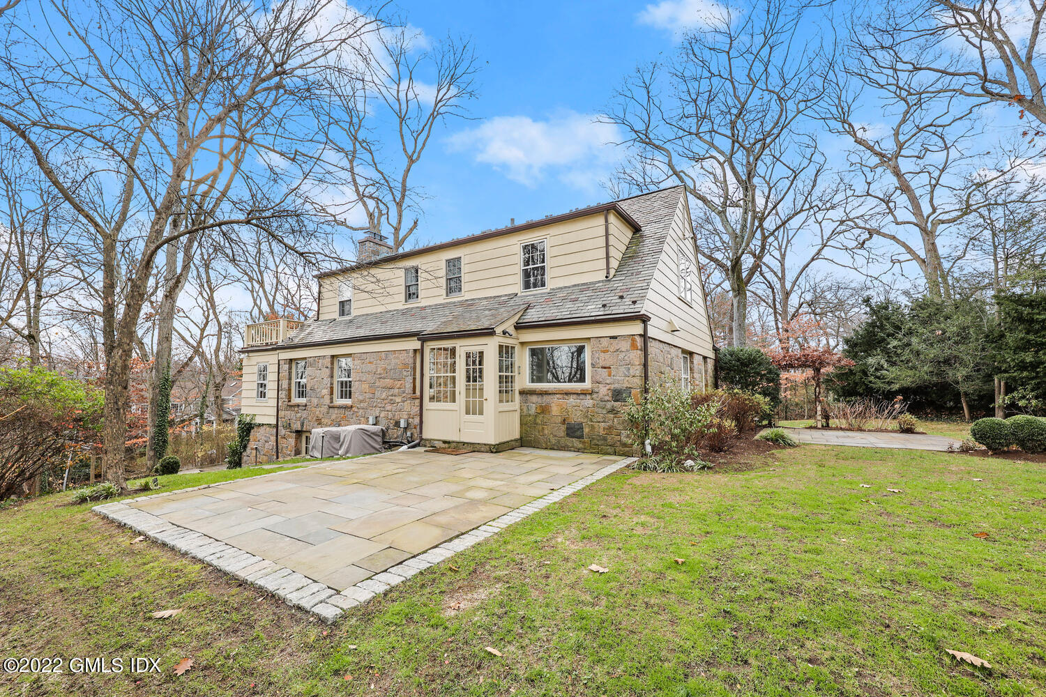 141 Hendrie Avenue Riverside, CT 06878 - Photo 19 of 24 a front view of a building with a yard