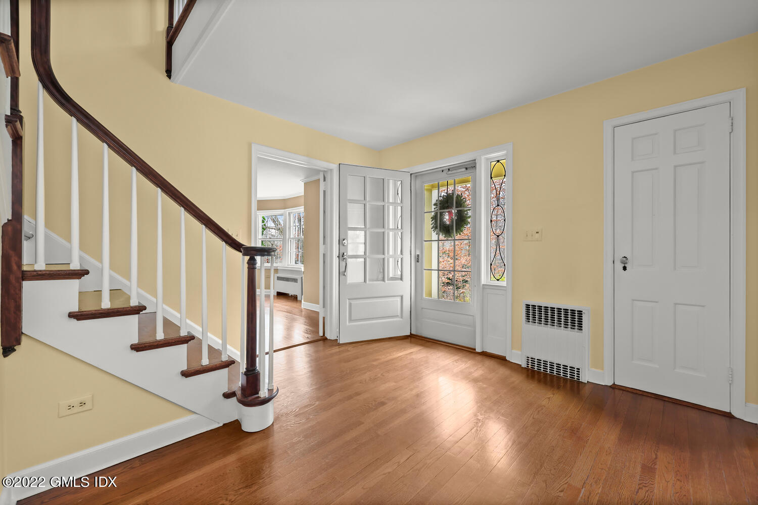 141 Hendrie Avenue Riverside, CT 06878 - Photo 3 of 24 a view of an entryway with wooden floor and door
