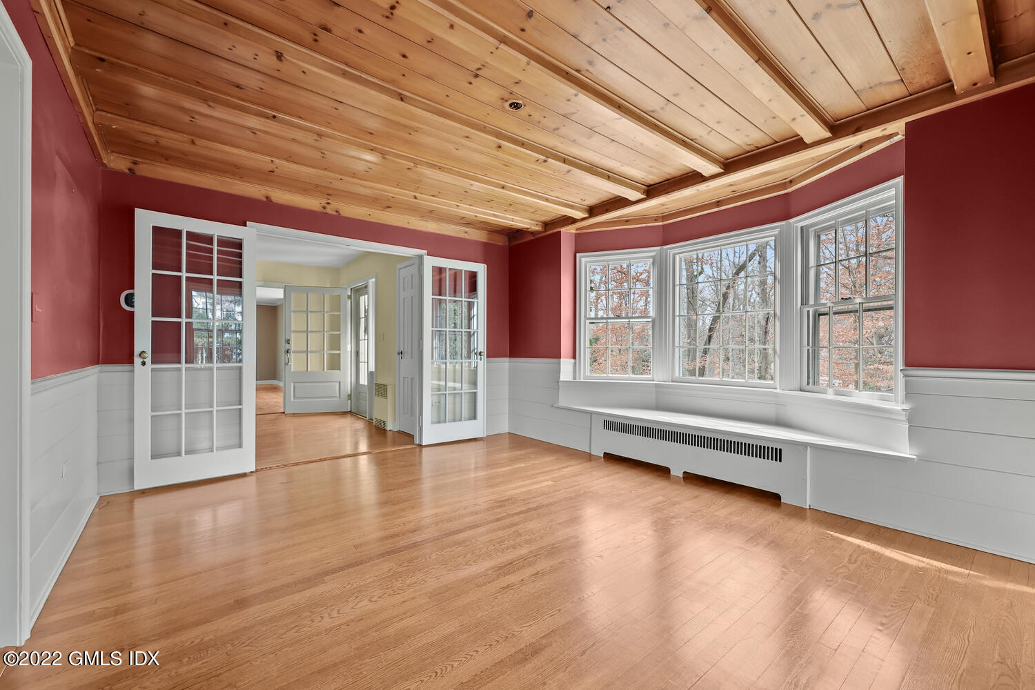 141 Hendrie Avenue Riverside, CT 06878 - Photo 8 of 24 a view of an empty room with wooden floor and a window