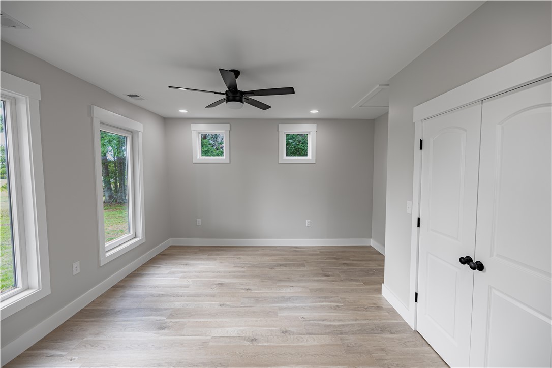 2817 Broadway Lake Road Anderson, SC 29621 - Photo 30 of 41 Luminous room featuring wide plank wood flooring and contemporary recessed lighting.