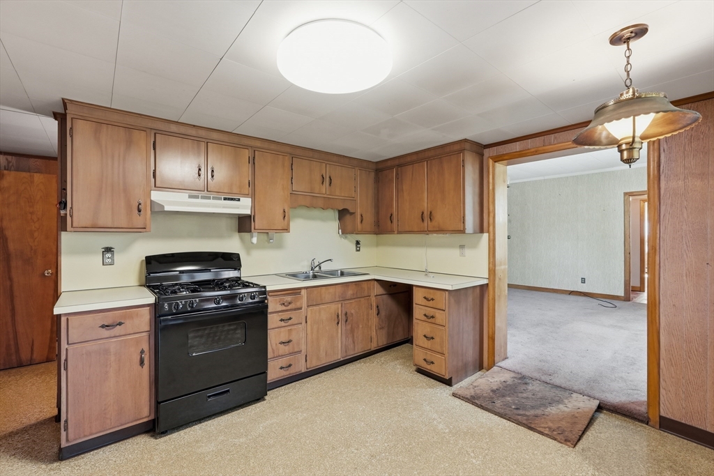 15 Main Street Hatfield, MA 01038 - Photo 11 of 42 a kitchen with stainless steel appliances granite countertop a stove sink and cabinets