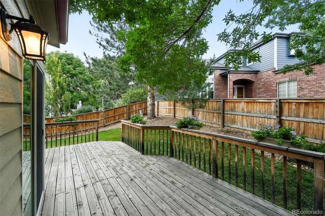 a view of balcony with wooden floor