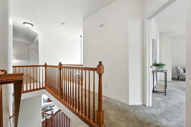 a view of a hallway with a dining room view