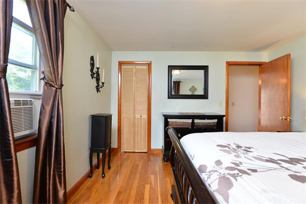 49 Farnham Road Stoughton, MA 02072 - Photo 13 of 28 a bedroom with a bed and a flat screen tv