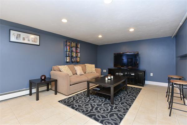49 Farnham Road Stoughton, MA 02072 - Photo 18 of 28 a living room with furniture and a flat screen tv