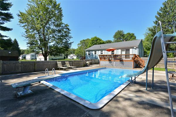 49 Farnham Road Stoughton, MA 02072 - Photo 23 of 28 a view of a swimming pool with a lounge chairs