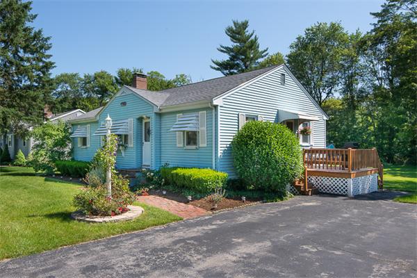 49 Farnham Road Stoughton, MA 02072 - Photo 28 of 28 a front view of a house with a garden and plants