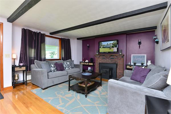 49 Farnham Road Stoughton, MA 02072 - Photo 4 of 28 a living room with furniture a flat screen tv and a fireplace