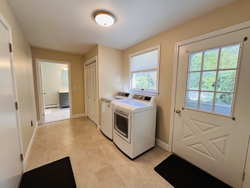 1107 Jackson Road Hardwick, MA 01037 - Photo 11 of 42 a kitchen with stainless steel appliances white cabinets and wooden floors