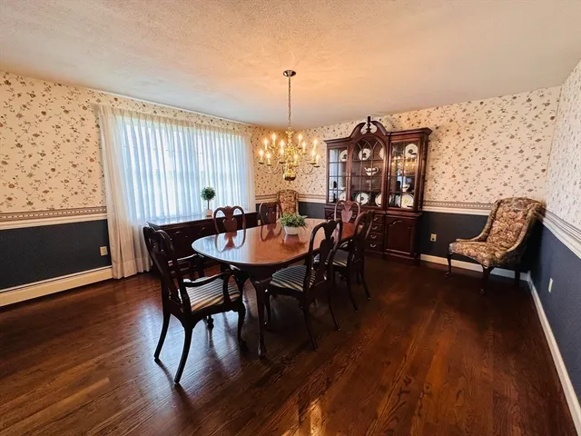 a view of a dining room with furniture and window