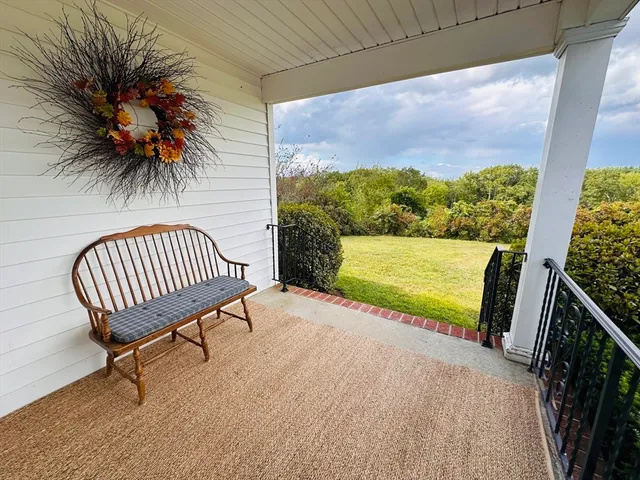 a view of a chair and table in the patio