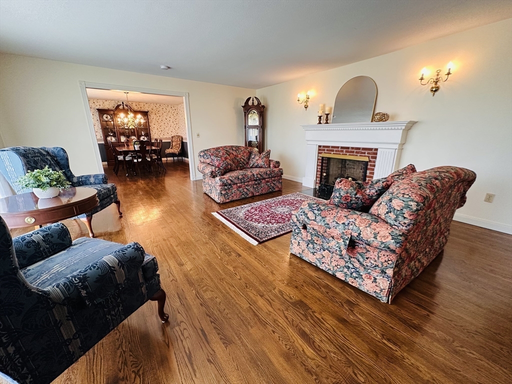 1107 Jackson Road Hardwick, MA 01037 - Photo 22 of 42 a living room with furniture and a fireplace