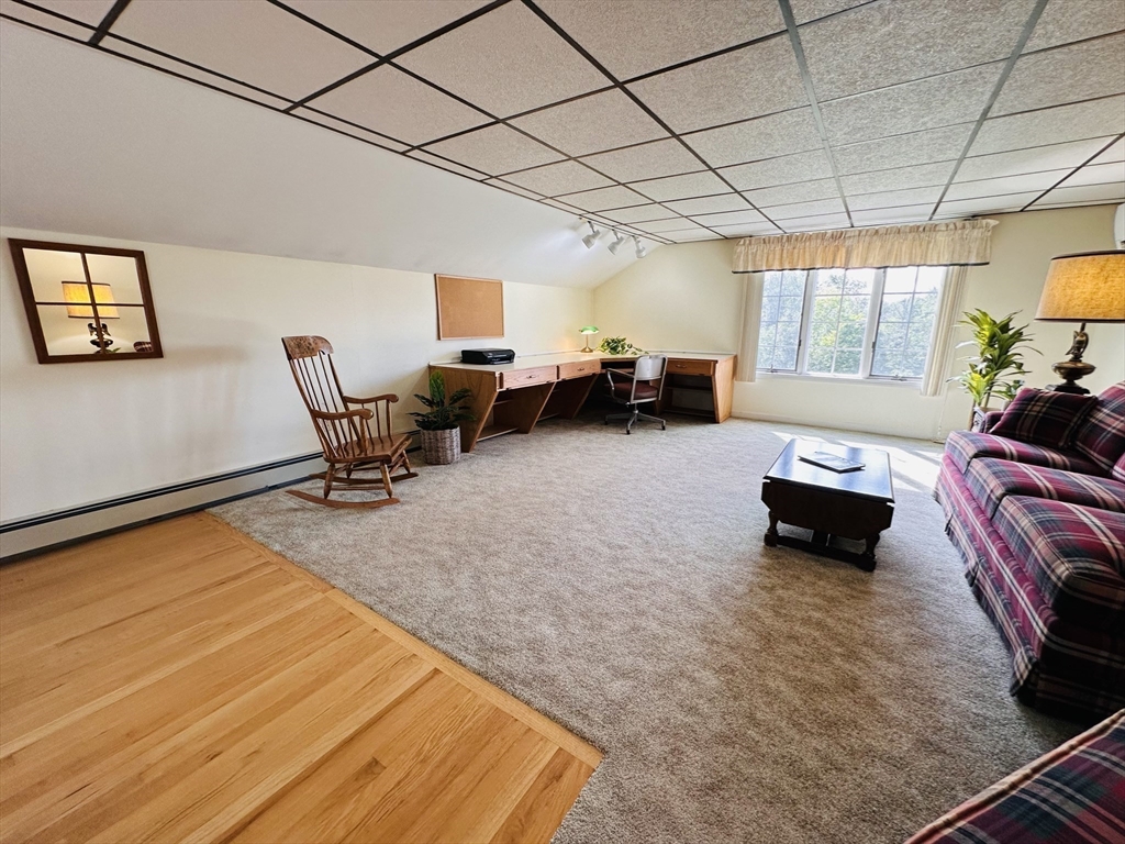 1107 Jackson Road Hardwick, MA 01037 - Photo 32 of 42 a living room with furniture and a flat screen tv