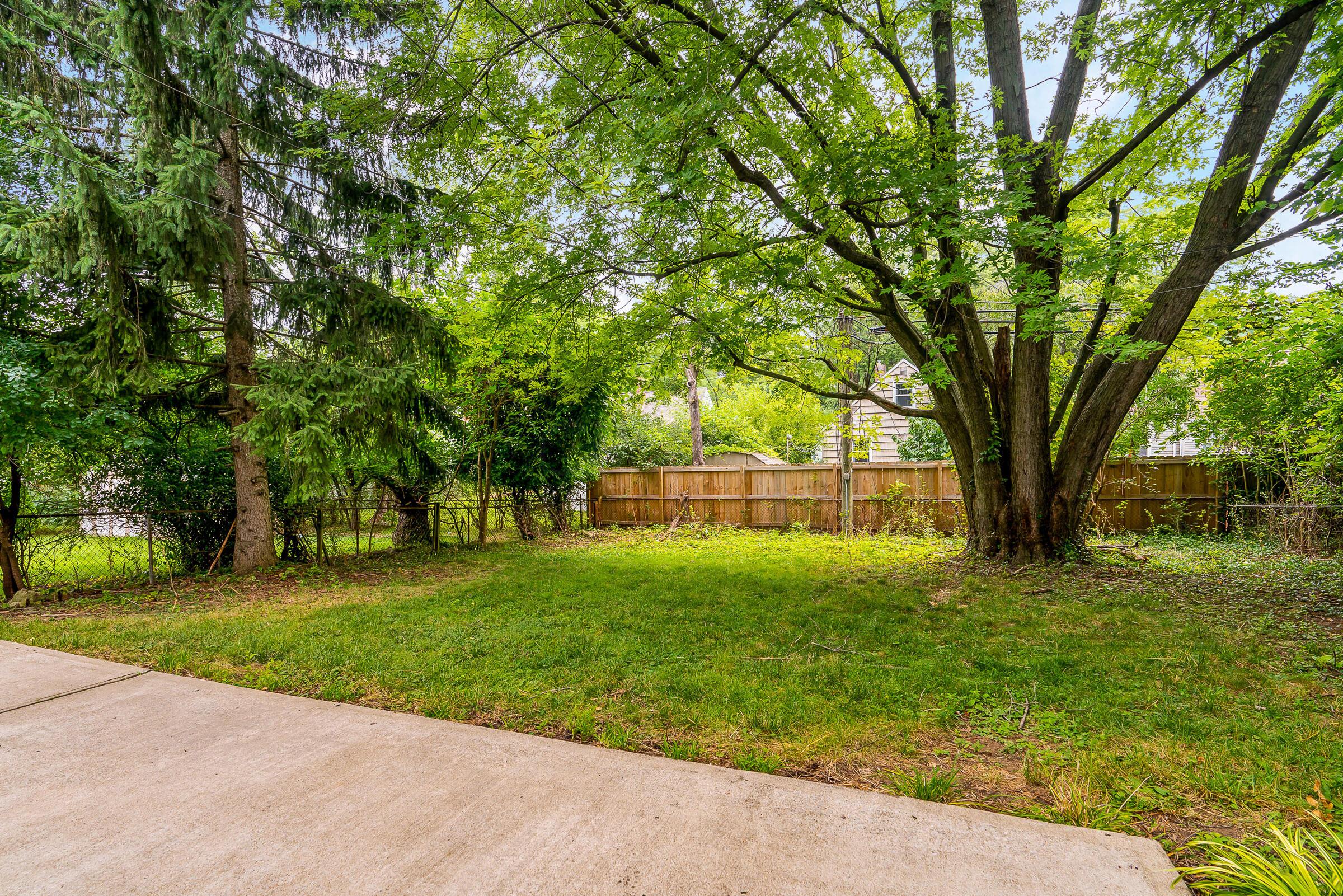 588 Northridge Road Columbus, OH 43214 - Photo 25 of 31 Patio overlooks the fenced yard with shade tree
