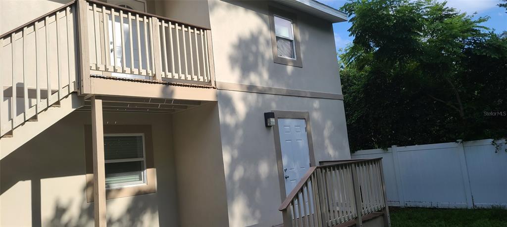 a view of a house with a street