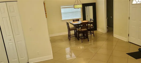 a view of a bathroom with a table and chair