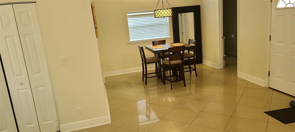 807 Turner Street, Unit 5 Clearwater, FL 33756 - Photo 3 of 6 a view of a bathroom with a table and chair