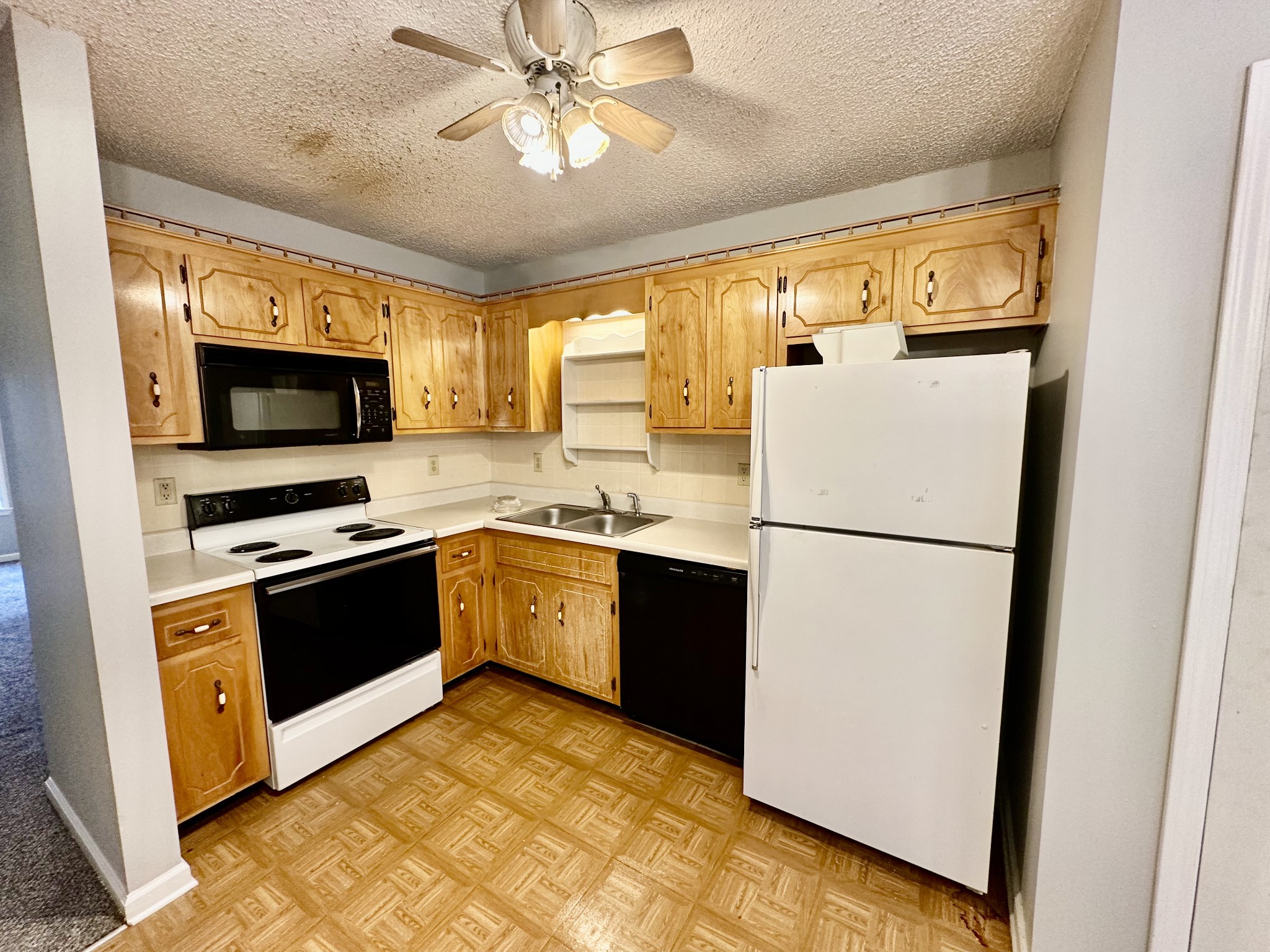 282 Raleigh Drive, Unit B Clarksville, TN 37043 - Photo 5 of 15 a kitchen with stainless steel appliances a refrigerator sink and microwave