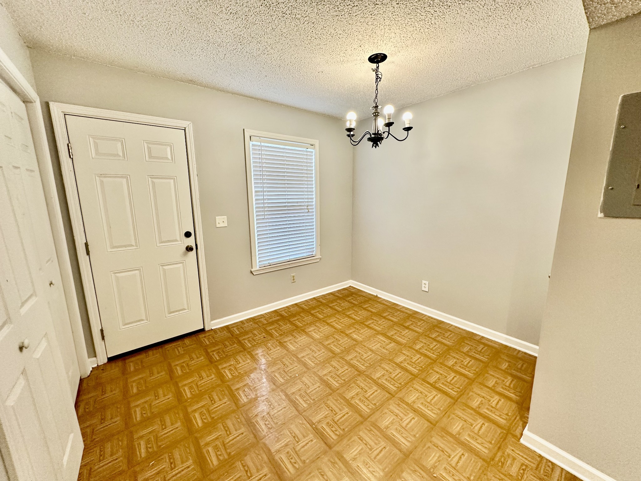 282 Raleigh Drive, Unit B Clarksville, TN 37043 - Photo 8 of 15 wooden floor in an empty room with a window