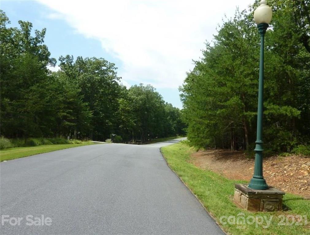 159 Wyle Wood Loop, Unit 38 Denton, NC 27239 - Photo 2 of 4 a view of a yard with plants and large trees