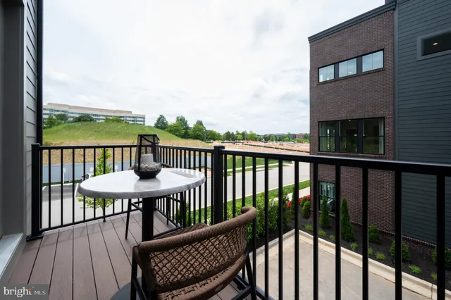a view of a deck with wooden floor and outdoor seating