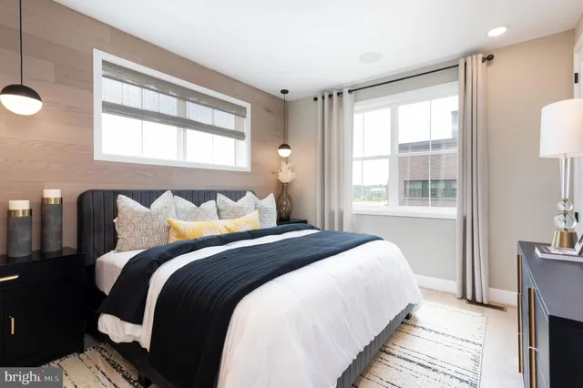 a bedroom with bed and a window