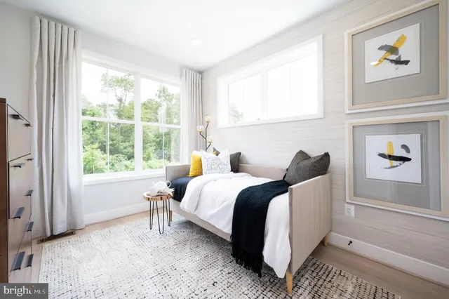 a bed room with a bed and a window