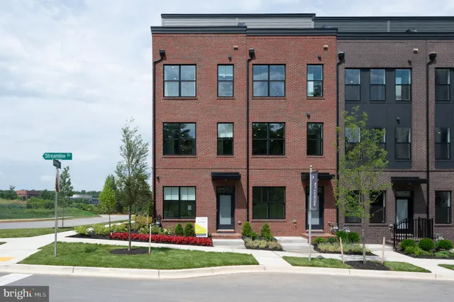 a front view of a building with street view