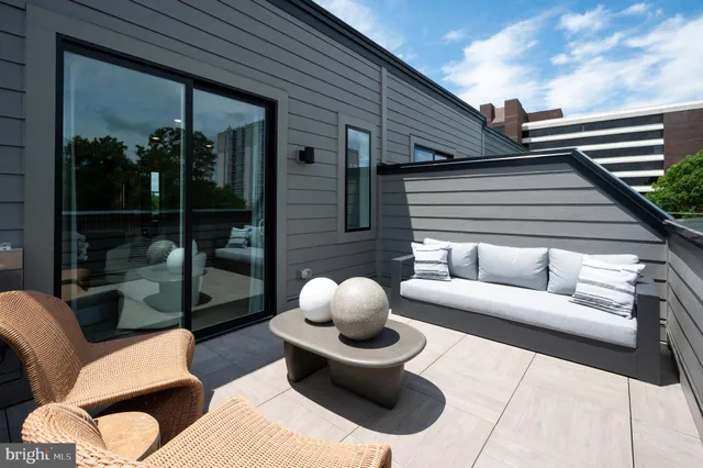 a outdoor space with patio the couches and a potted plant