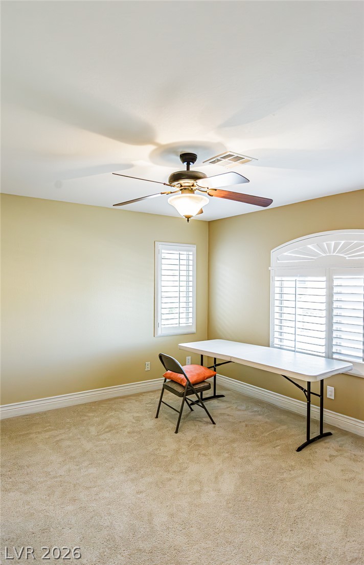 75 Tall Ruff Drive Las Vegas, NV 89148 - Photo 27 of 64 Arched windows and soft carpeting create a tranquil atmosphere in this versatile workspace.