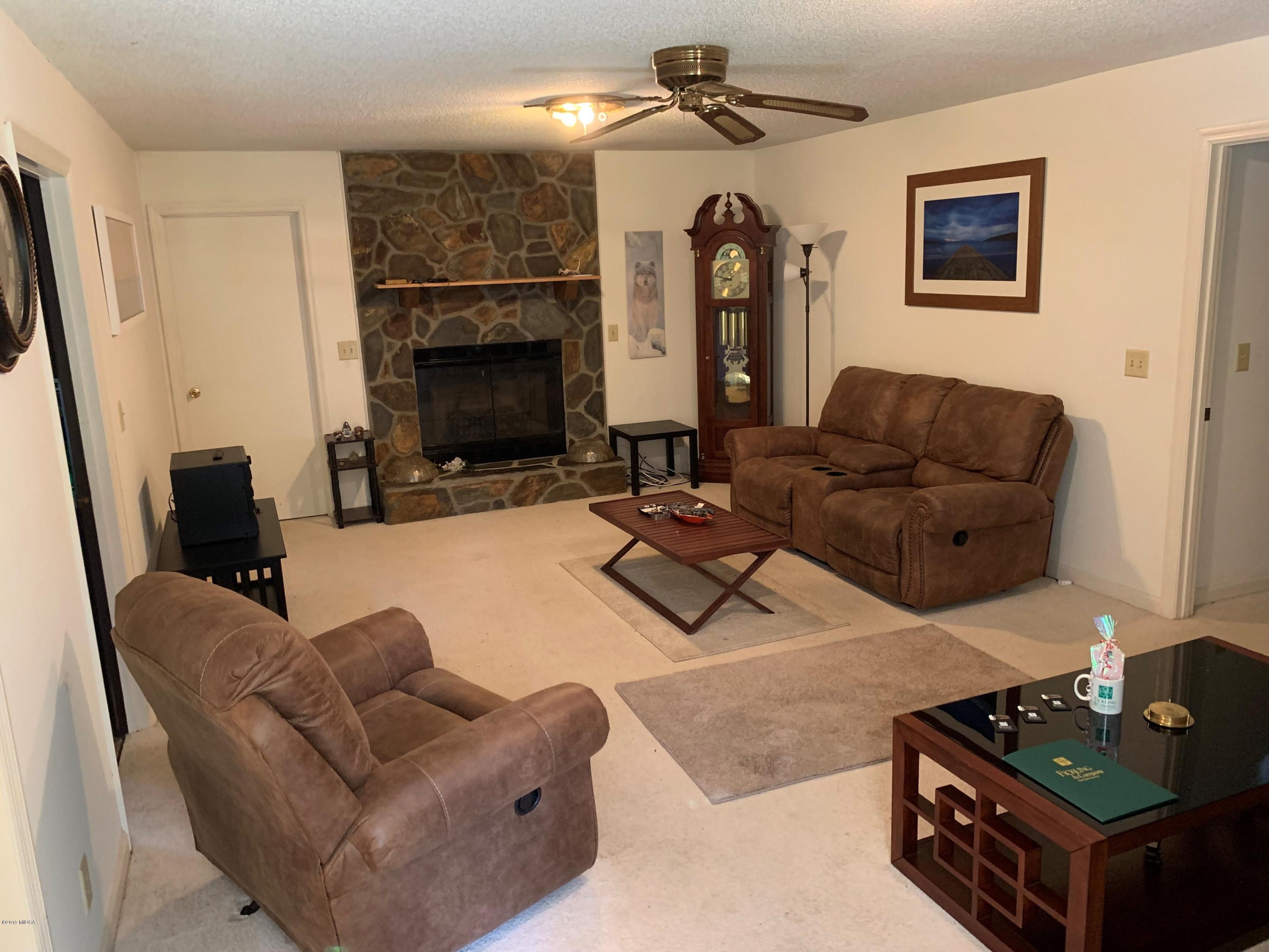3295 Hartley Bridge Road Macon, GA 31216 - Photo 4 of 11 a living room with furniture and a fireplace
