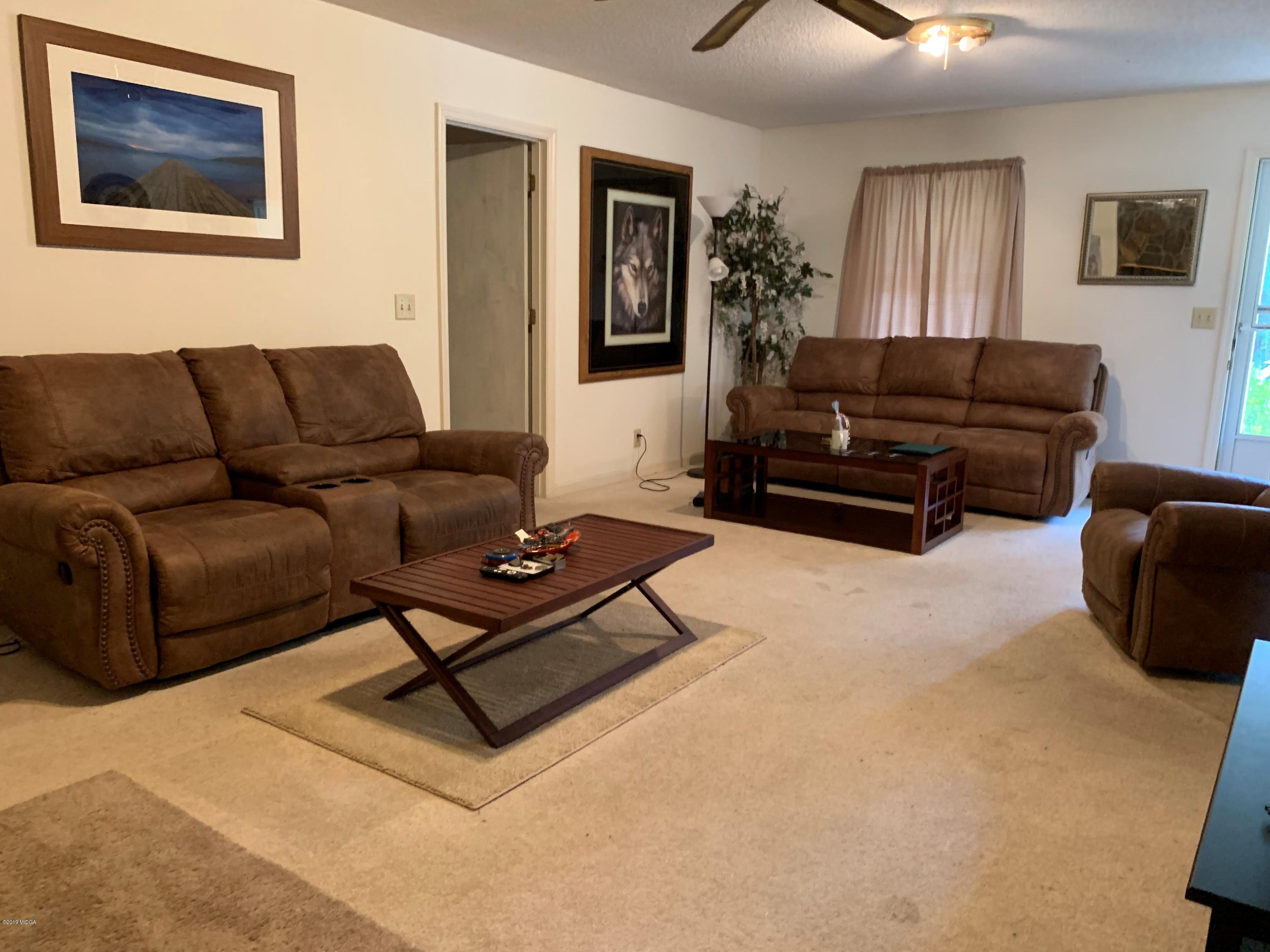 3295 Hartley Bridge Road Macon, GA 31216 - Photo 5 of 11 a living room with furniture and a window