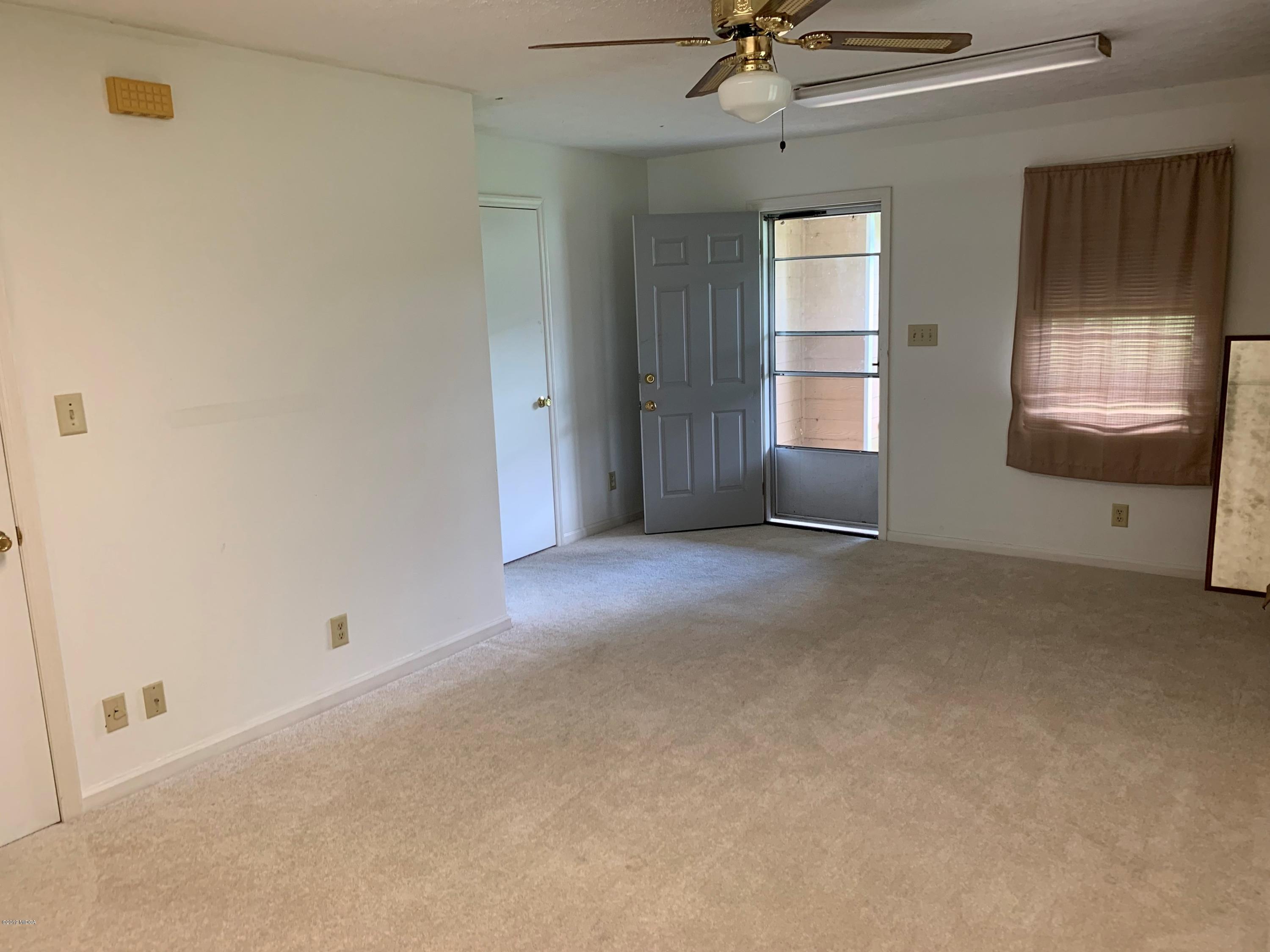 3295 Hartley Bridge Road Macon, GA 31216 - Photo 7 of 11 a view of a room with window and ceiling fan