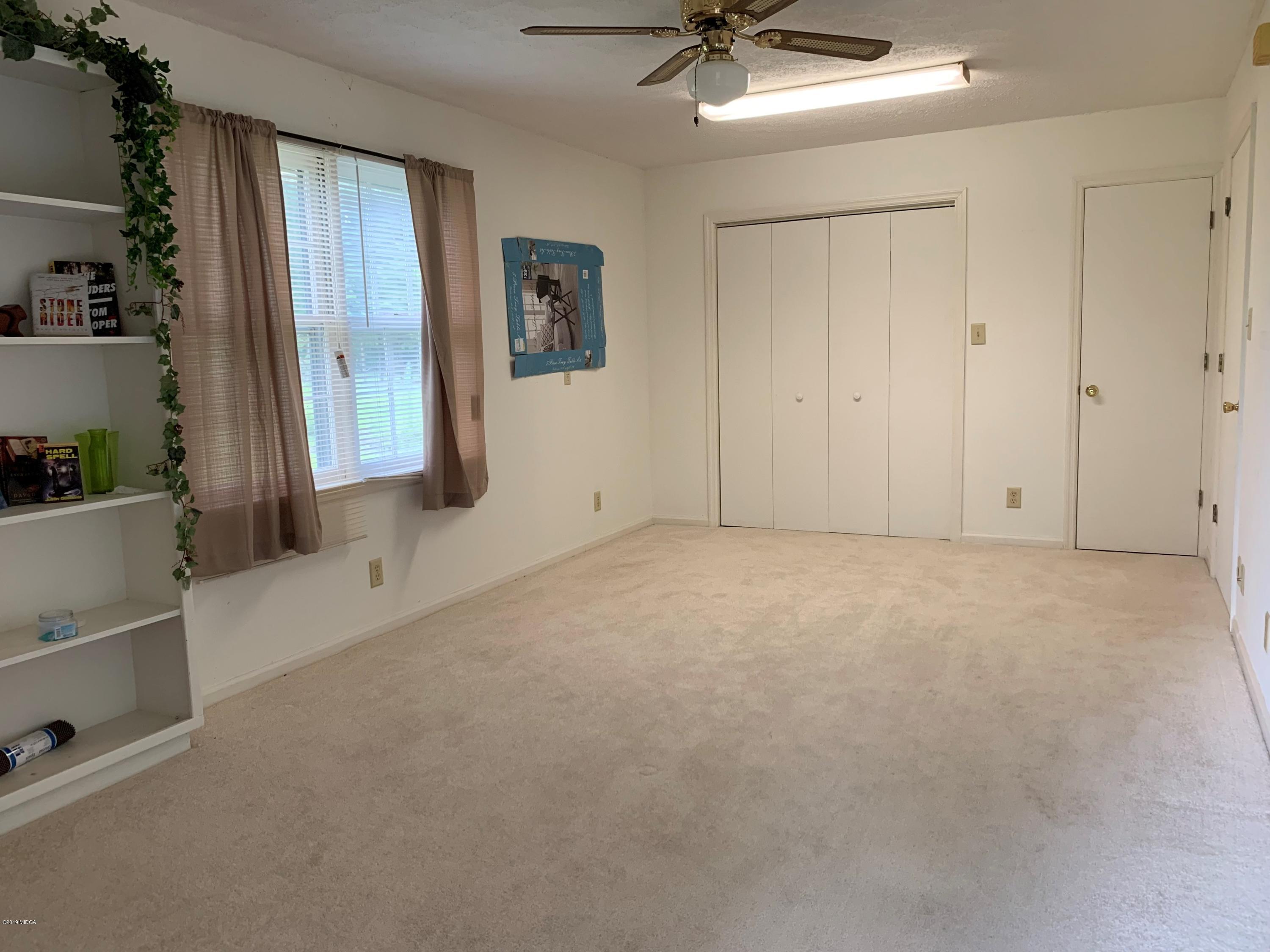 3295 Hartley Bridge Road Macon, GA 31216 - Photo 8 of 11 a view of an empty room with a window