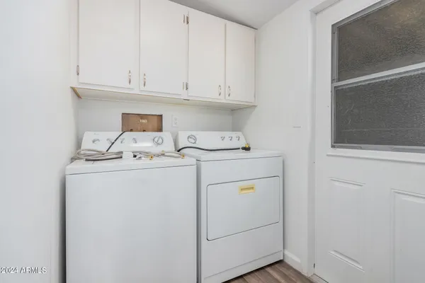 a view of a living room with a wooden floor
